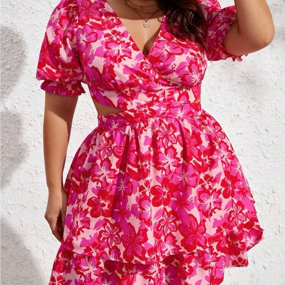 Cute mid-length pink floral dress with cutouts!